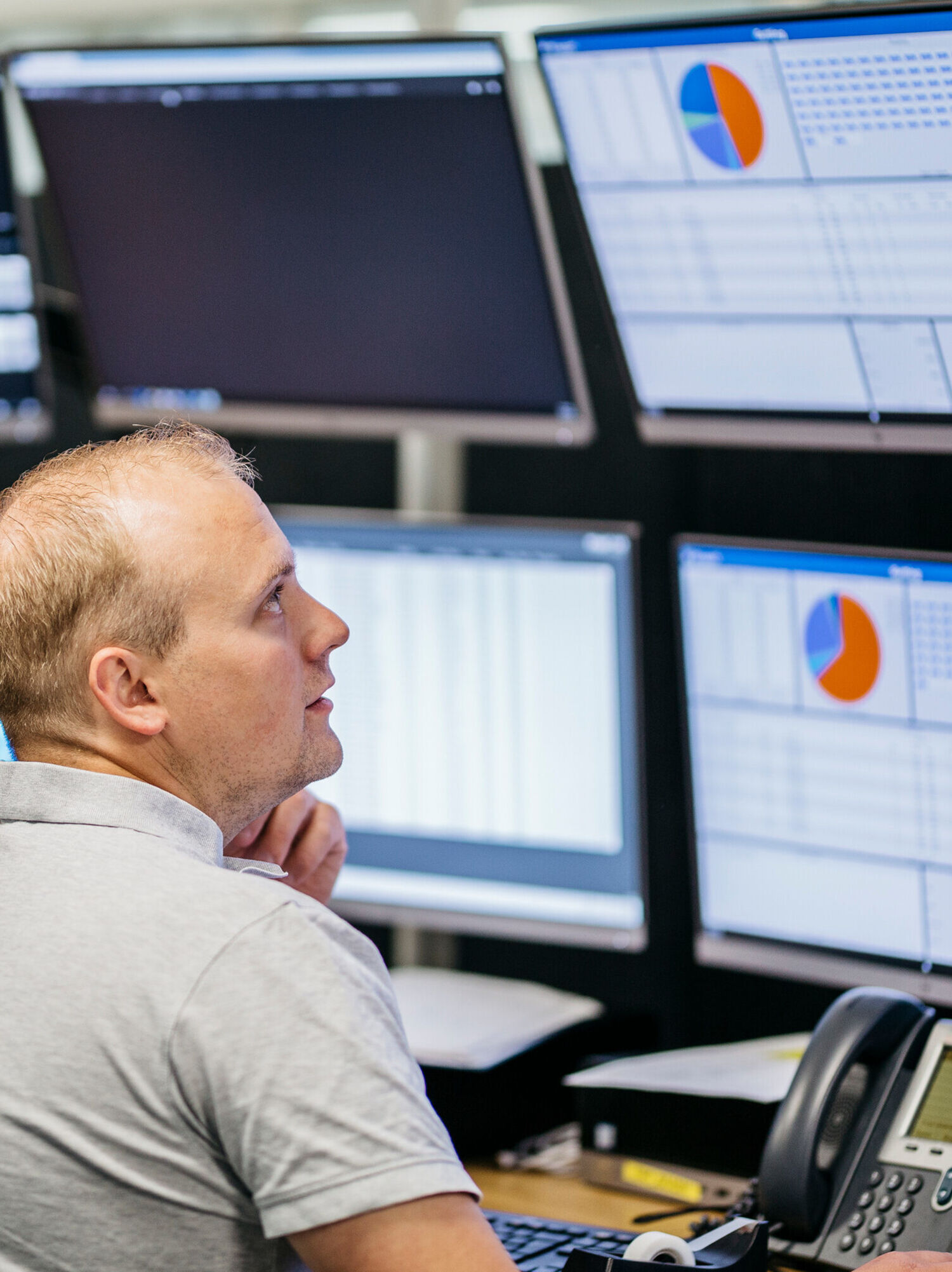 Employees checking screen in the processing plant