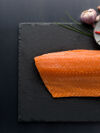 Salmon filet on slate plate