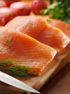 Salmon filet being prepared on a kitchen countern