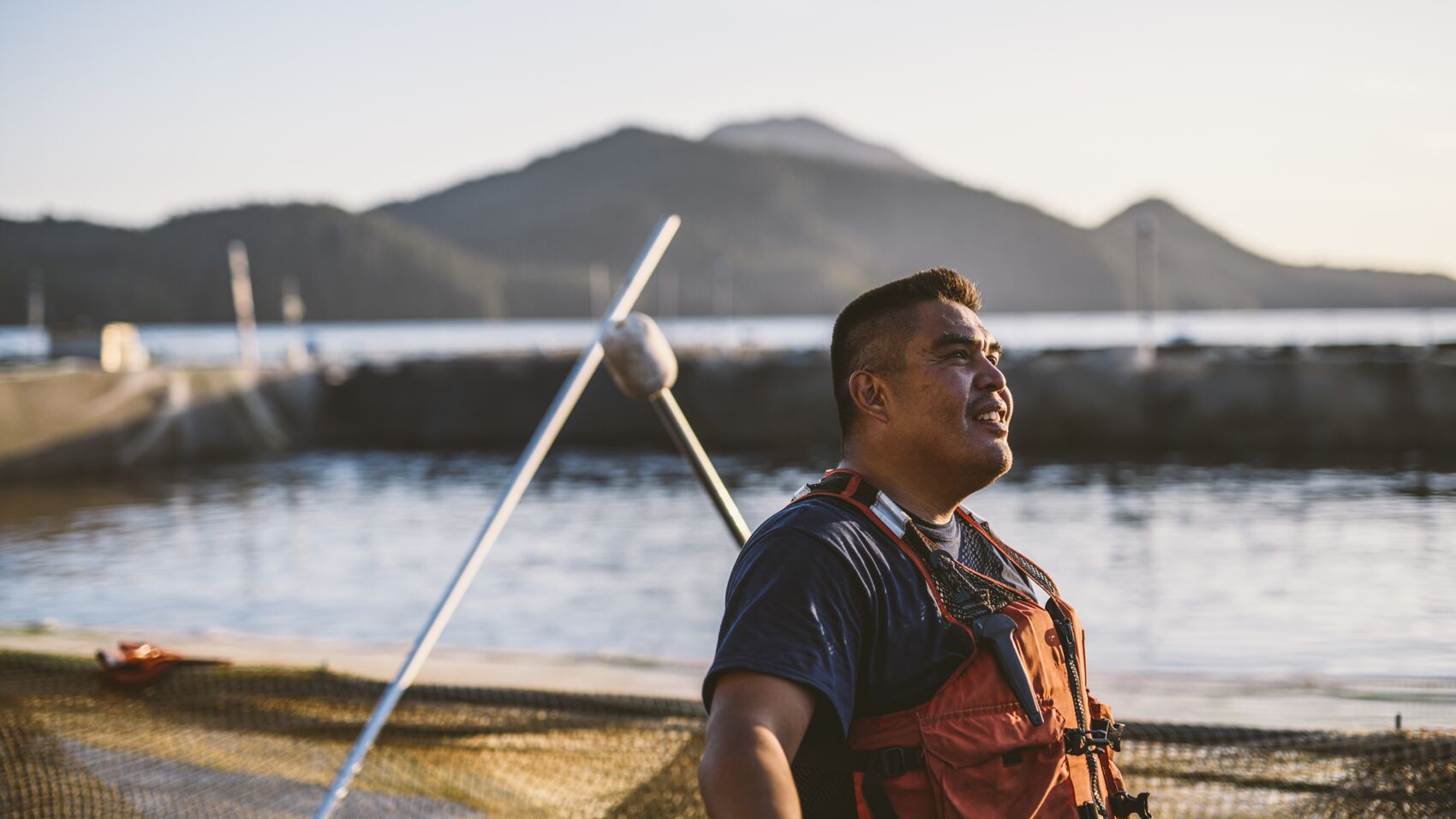 First Nation employee looking into sun and wind