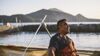 First Nation employee looking into sun and wind